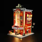 Lumibricks Theatre illuminated at night.