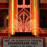 Close-up of illuminated Balcony Theatre marquee.