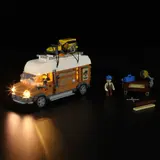 Lit Carpentry Van at night, side view.