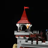 Illuminated castle tower with minifigure and cannon.