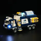 Urban Restore truck, lights ablaze at night.