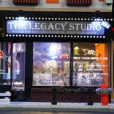 Close-up of brightly lit studio sign.