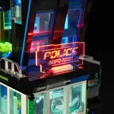 Close-up, glowing police sign.