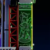 Green illuminated vertical display panel.