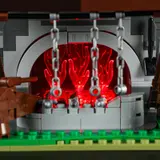 Forge fire close-up, red glow.