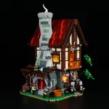 Forge House at night, lit up.