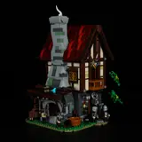 Forge House front, lights on.