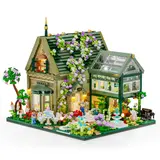 Wisteria-covered house and greenhouse.