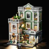 Clinic model at night, showing tree and balcony lights.