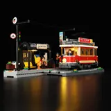 Lighted tram and station, night view.