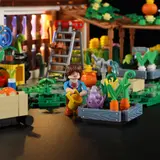 Close-up of minifigure gardener and brick-built plants.