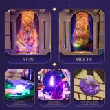 Collage of illuminated details: Sun/Moon windows, glowing crystal ball, potion, stained glass.