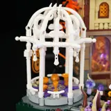 Close-up of Lumibricks Retro House 10014's white healing pavilion with golden gong.