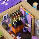Interior of Lumibricks Retro House 10014's 'Witch's Kitchen' with sign and tools.