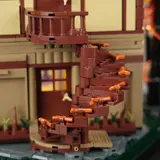 Close-up of Lumibricks Retro House 10014's dark brown spiral staircase.