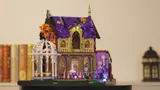 Upper gable of Lumibricks Retro House 10014 with intensely glowing window.