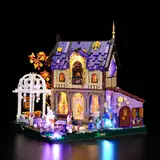 Lumibricks Retro House 10014 at night with multi-colored LED lighting.