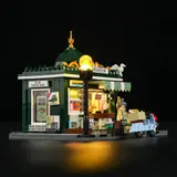 Side view, lit newsstand, scooter.