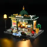 Front-side view, lit newsstand interior.