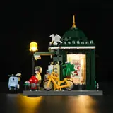 Opposite side view, lit newsstand.