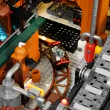 Mine cart with glowing crystals on curved track.