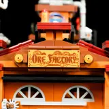 Close-up of 'Ore Factory' sign.