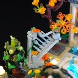 Staircase with SNOT railing and lit tree.
