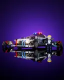 Police car reflected on purple surface.