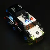 High-angle view of fully lit armored convoy.