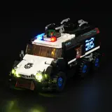 Illuminated urban convoy, low front-right angle.