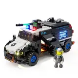 Armored police vehicle with minifigure in a studio, lights on.