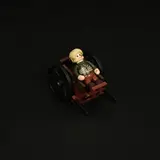 Minifigure resting on cart.