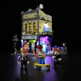 Minifigures on a lit street with blurred building.