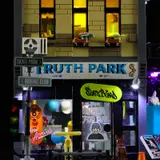 Close-up of illuminated shopfront.