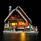 Frontal night view of the illuminated Ski Lodge facade.