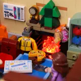 Ski Lodge interior, glowing fireplace and ski rack close-up.
