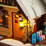Illuminated entrance lantern and textured door.