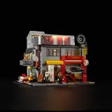 Illuminated garage with balcony detail.