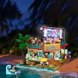 Night view of the surf shop with integrated lighting activated.