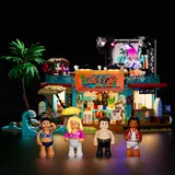 Minifigures in beach attire with the surf shop behind.
