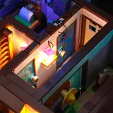 Multi-room interior with mixed lighting.