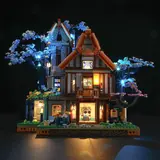 Fully lit Sylvan Inn model at night.