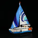 Illuminated sailboat at night.