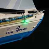Sailboat bow with green light.
