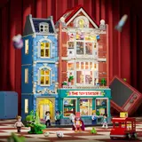 Illuminated Toy Station building, red background.