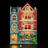 Lit Toy Station facade, dark background.