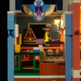 Lit blue building mid-floor, spaceship model.