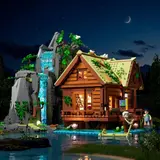 Waterfall Cabin glowing at night.