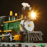 Close-up of locomotive headlight and cowcatcher.