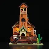 Front view of illuminated hall's entrance and bell tower.